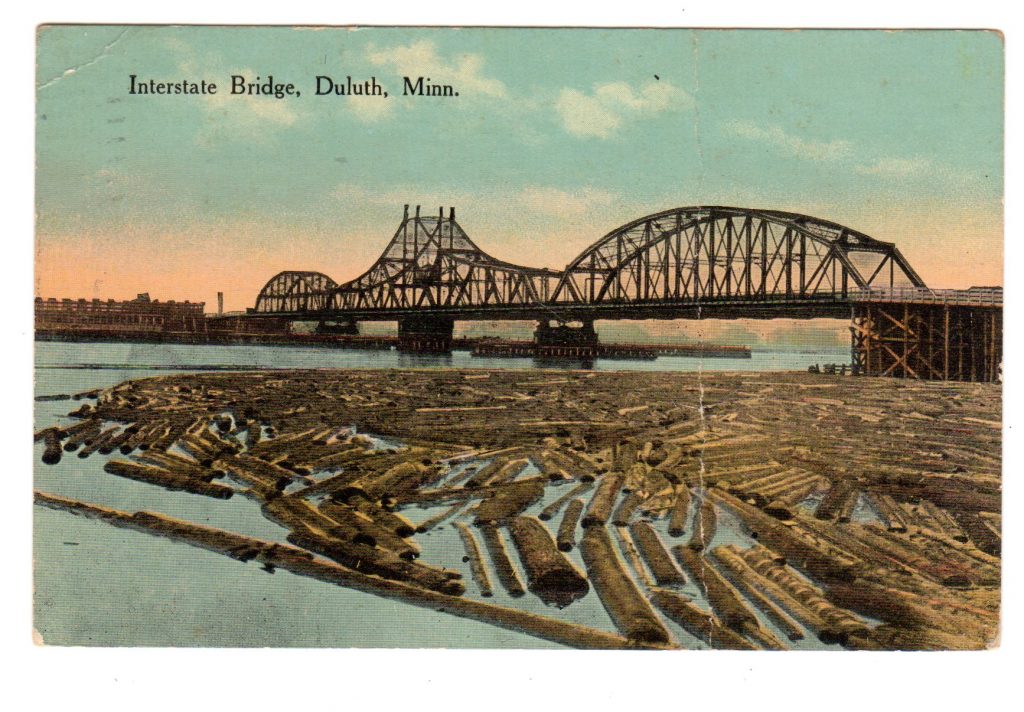 Old postcard. Interstate Bridge, Duluth, Minnesota. Lumber, logs 1915