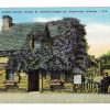 Linen postcard.  Oldest School House, St George St, St Augustine, Florida.  Old black man with ox and cart standing on right side.