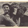 Postcard.  Stahkanovite (productive worker) Grape Gatherer in the Crimea.  Russia. Woman with basket of grapes.