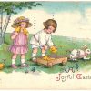 Old postcard.  A Joyful Easter.  Boy, girl, children, rabbit pulling wagon, baby chicks.
