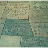 Chrome postcard.  Footprints of the Stars, forecourt Grauman's Chinese Theatre, Los Angeles, California.  Shirley Temple, Edgar Bergen, Esther Williams.  1956.