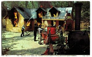 Chrome postcard.  Burning Wells Fargo Relay Station on the CP & LE Railroad, Fabulous Funway, Cedar Point, Sandusky, Ohio.  Space Spiral Ride.