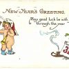 Old postcard. New Year's Greetings. May good luck be with you through the year.  Naked baby, trumpet, bell, santa hat, cherub, magic lamp, embossed, 1913.