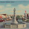 Linen postcard.  Boll Weevil Monument, Enterprise, Alabama.  Signs:  Goodyear, Kelvinator.  Old cars.