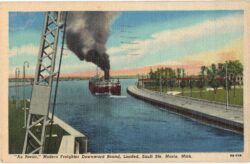 Linen postcard.  Au Revoir, Modern Freighter downward bound, Loaded, Sault Ste Marie, Michigan. Ship, 1951.