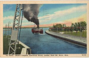 Linen postcard.  Au Revoir, Modern Freighter downward bound, Loaded, Sault Ste Marie, Michigan. Ship, 1951.
