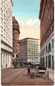 Old postcard.  Junction of Market, Post and Montgomery Streets, San Francisco, California.  Street car, horse and wagon.  1910.