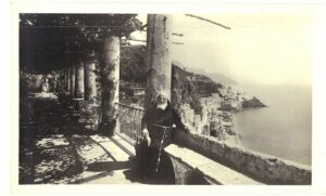 Real Photo Postcard. Monk sitting on wall, Hotel Cappuccini, Amalfi, Italy. RPPC.