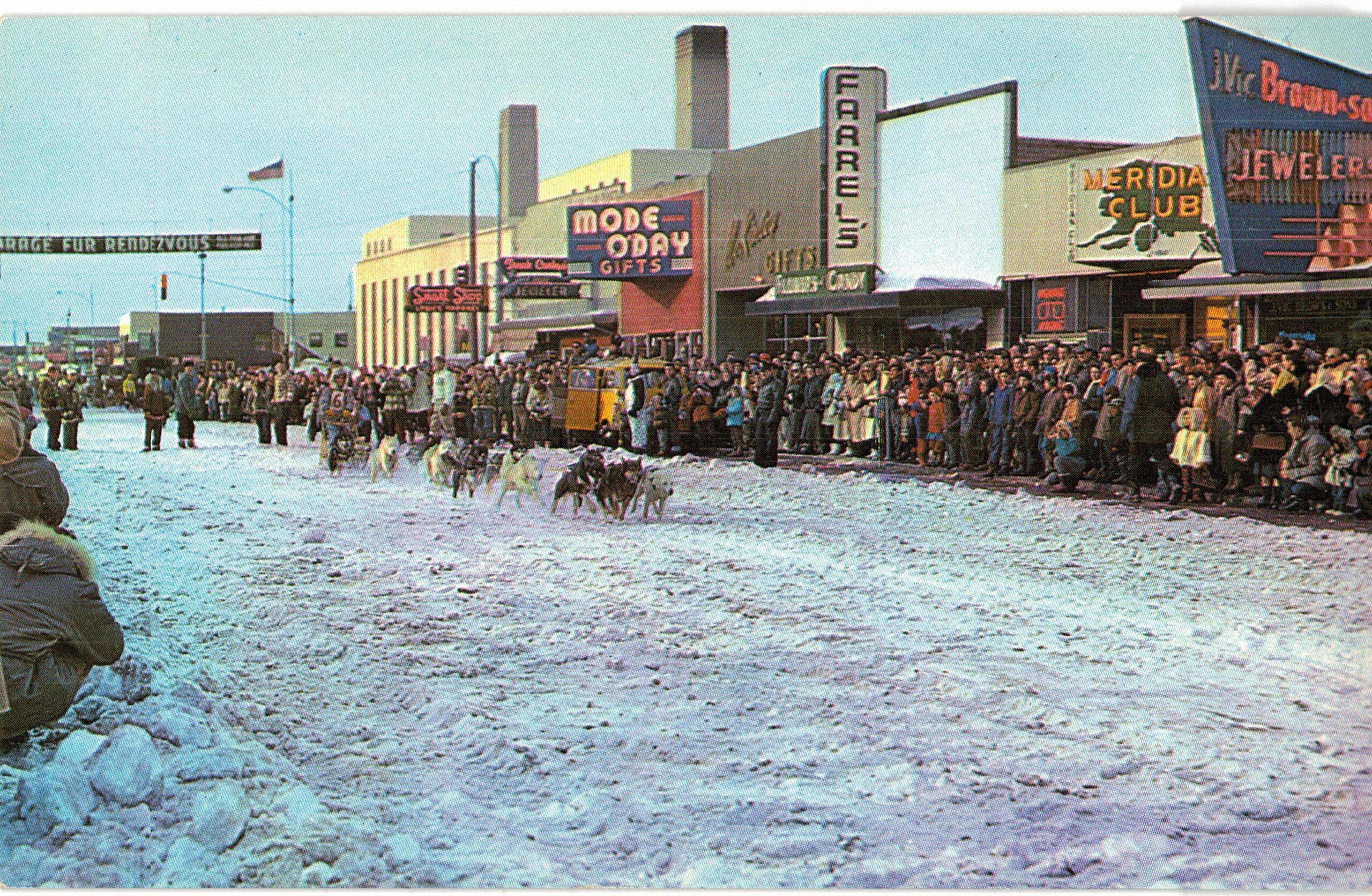 Chrome postcard. Fourth Avenue, Anchorage, Alaska. All American City. Sled dog racing, Fur Rendezvous.