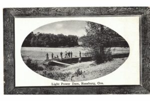 Old postcard.  Light Power Dam, Roseburg, Oregon.  Men.